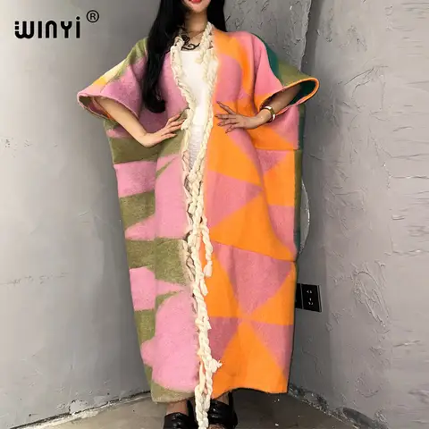 معطف طويل دافئ مزين بشراشيب وفراء للنساء من WINYI